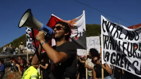 Nationwide Strikes Erupt Opposing Budget Cuts